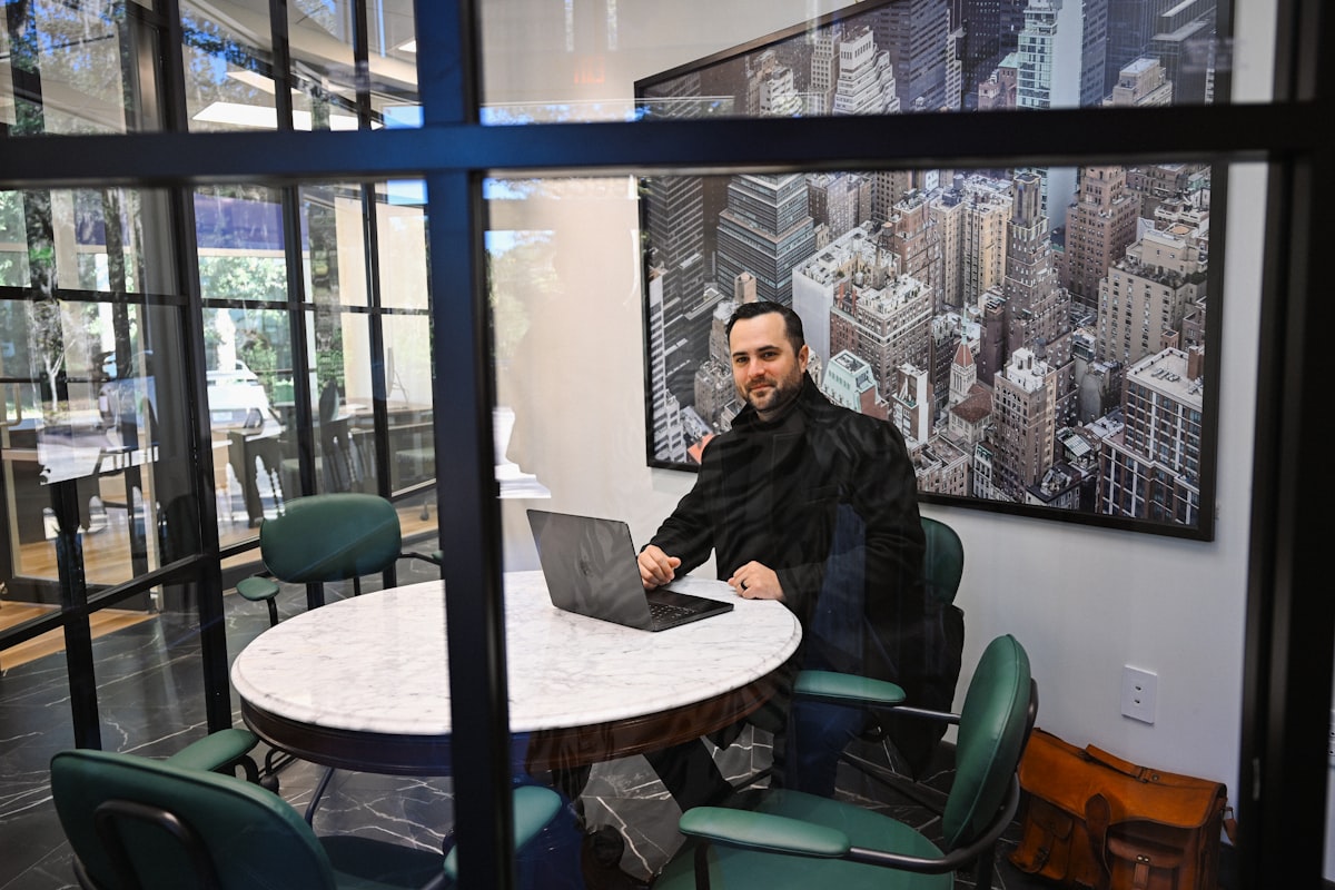 Nexpa team member working on a laptop
