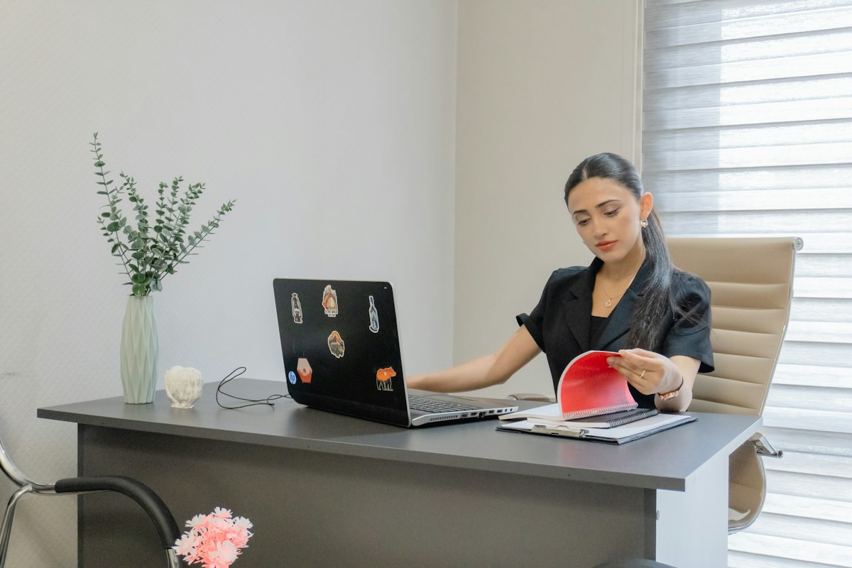 Person reviewing documents at a desk