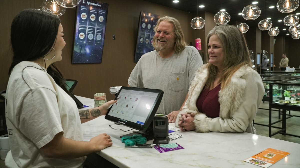 Business owner serving a customer directly
