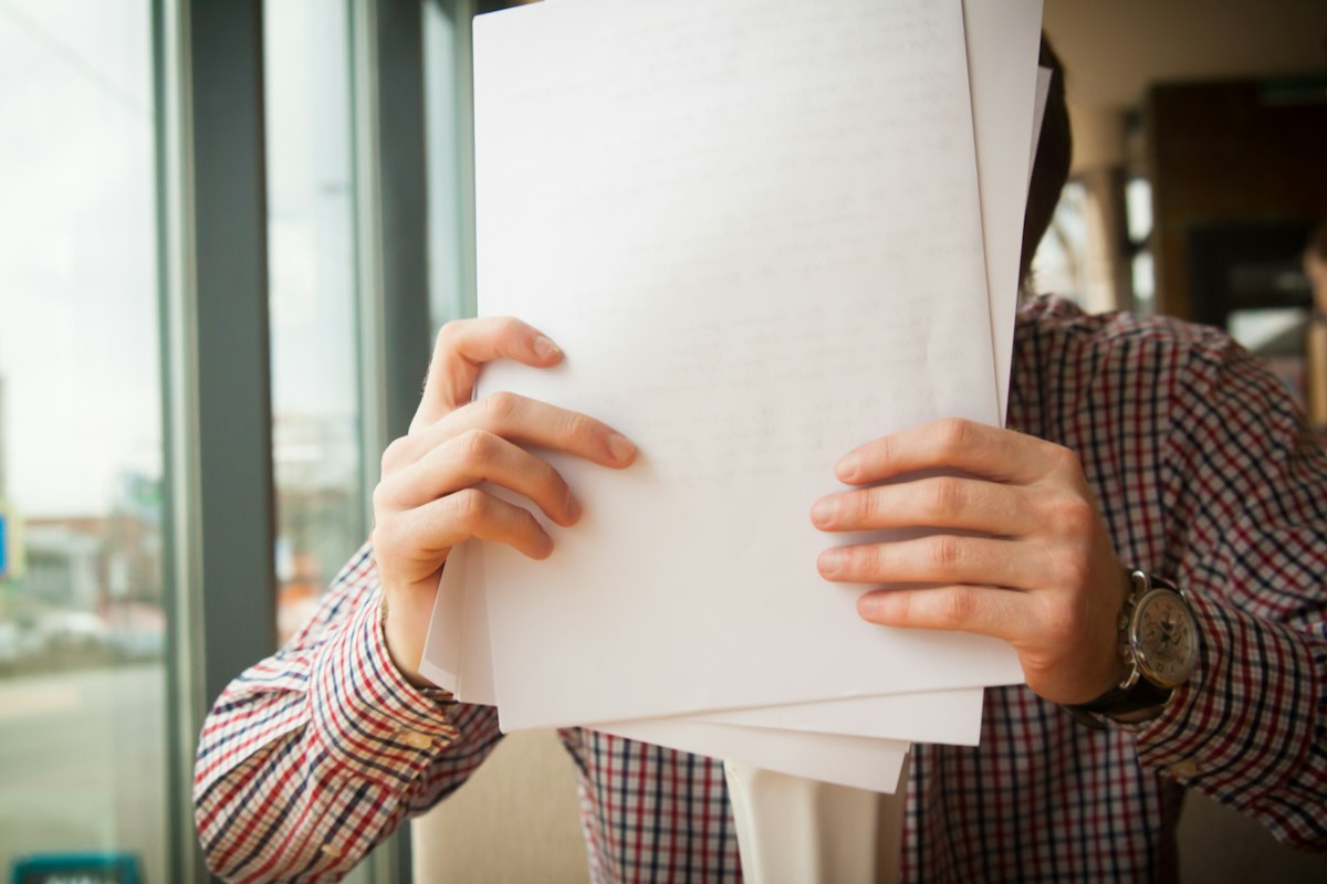 Tariff administrator reviewing carrier documents